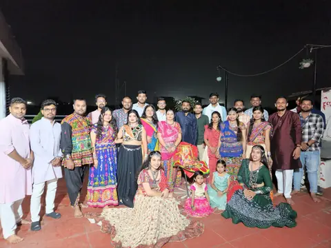 Team members in colorful traditional Garba attire at a Navratri festival celebration