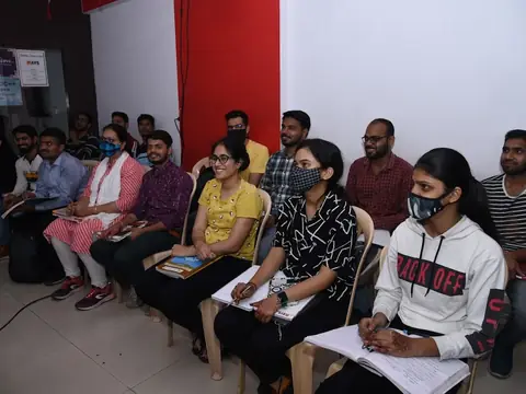 Students attending a Rays EdTech classroom session with notebooks
