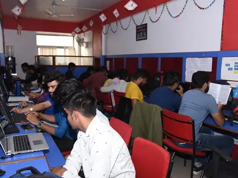 Students working on laptops in a computer lab at Rays EdTech