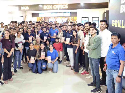 Team outing to the movies, students and staff gathered at a cinema box office