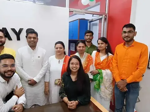 Team members in tricolor attire celebrating a national holiday at the Rays EdTech office