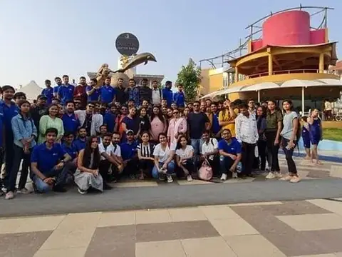 Large group photo of students and staff on an outing at a water park