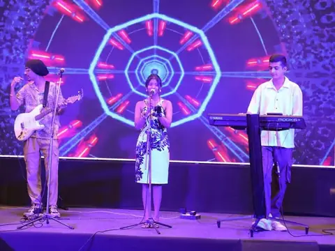 Live band performance on stage at a Rays EdTech event