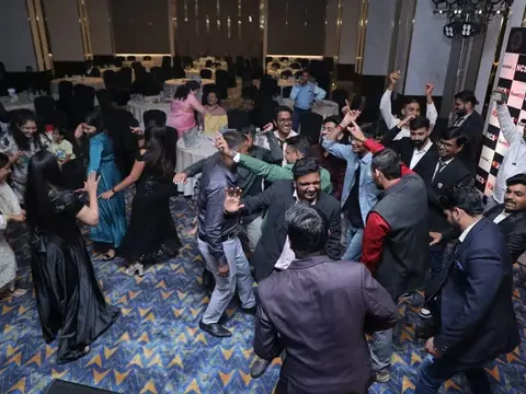 Large crowd of staff dancing together at the 17th TechVersary anniversary party