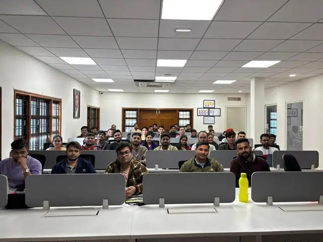 Large group of trainees seated at computer desk rows in the Rays EdTech training hall