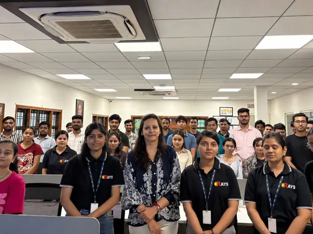 Close-up view of students seated at computer workstations during a training session at Rays EdTech
